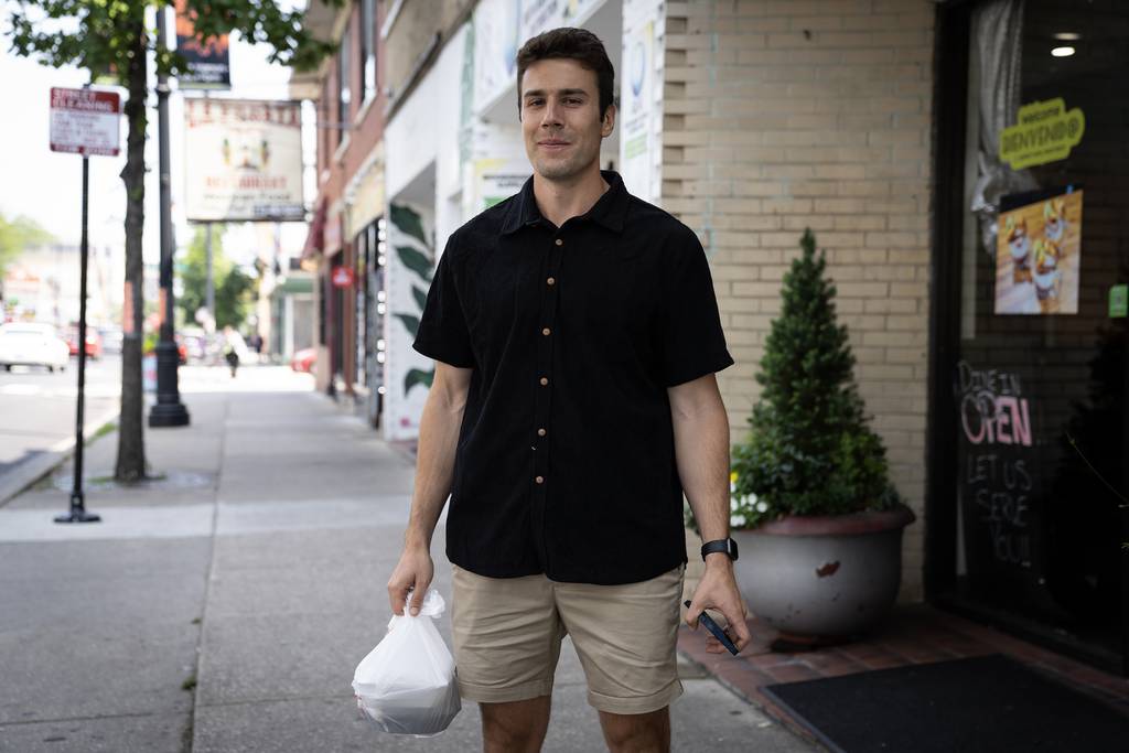 Cam Brenson is seen in front of the Albany Park Guatemalan restaurant El Quetzal in Chicago on August 4, 2023. 