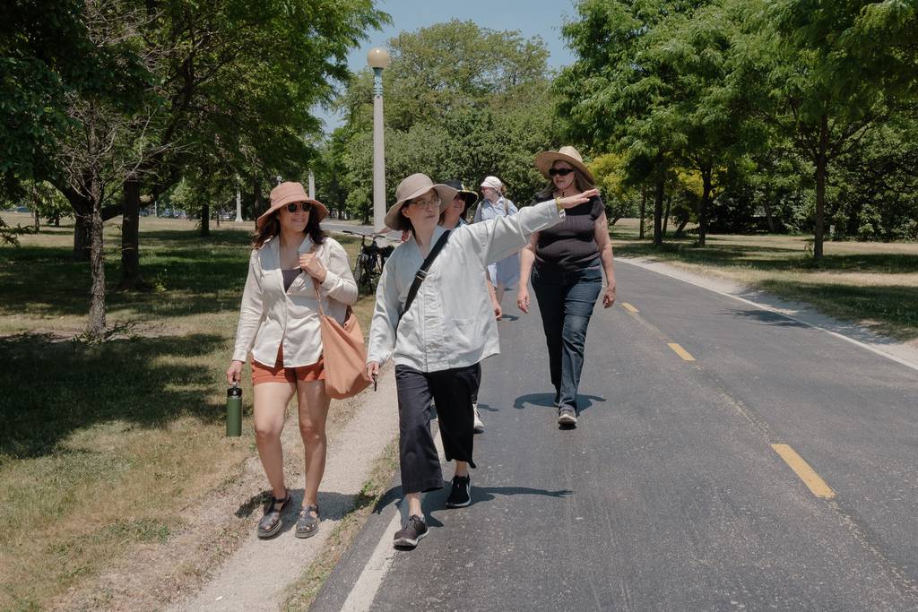Artist, writer, and activist JeeYuen Lee leads an audio tour along the Lakefront Trail in Chicago on June 10, 2023.