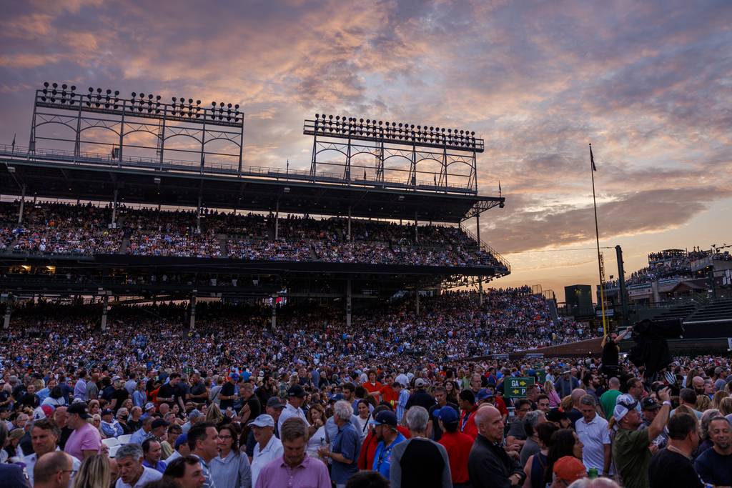 The sun is setting as audiences wait for Bruce Springsteen and the E Street Band to perform at Wrigley Field on August 9, 2023.