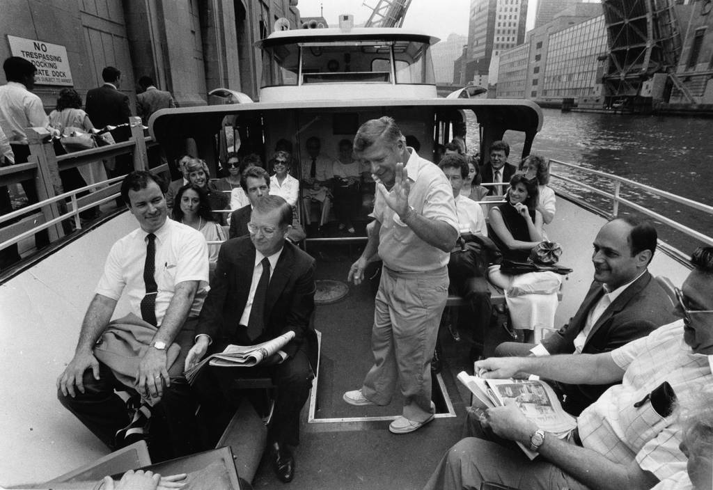 Robert Borgtrom, Wendella president and captain of the Wendella Sunliner headquarters, offers riders a free ride and free coffee on July 24, 1987, to celebrate the 25th anniversary of the company's transportation between Chicago's Madison Street and Michigan Avenue piers.