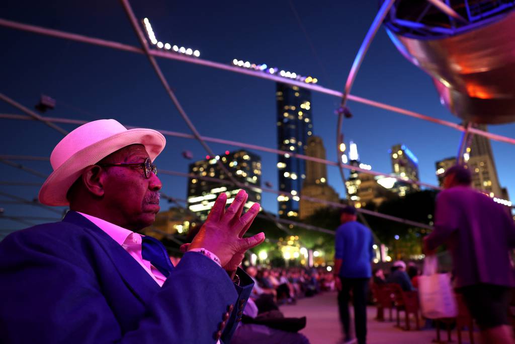 Springfield native Ahmed Benbayla rests in Millennium Park's Pritzker Pavilion as he attends the Chicago Jazz Festival on August 31, 2023.  