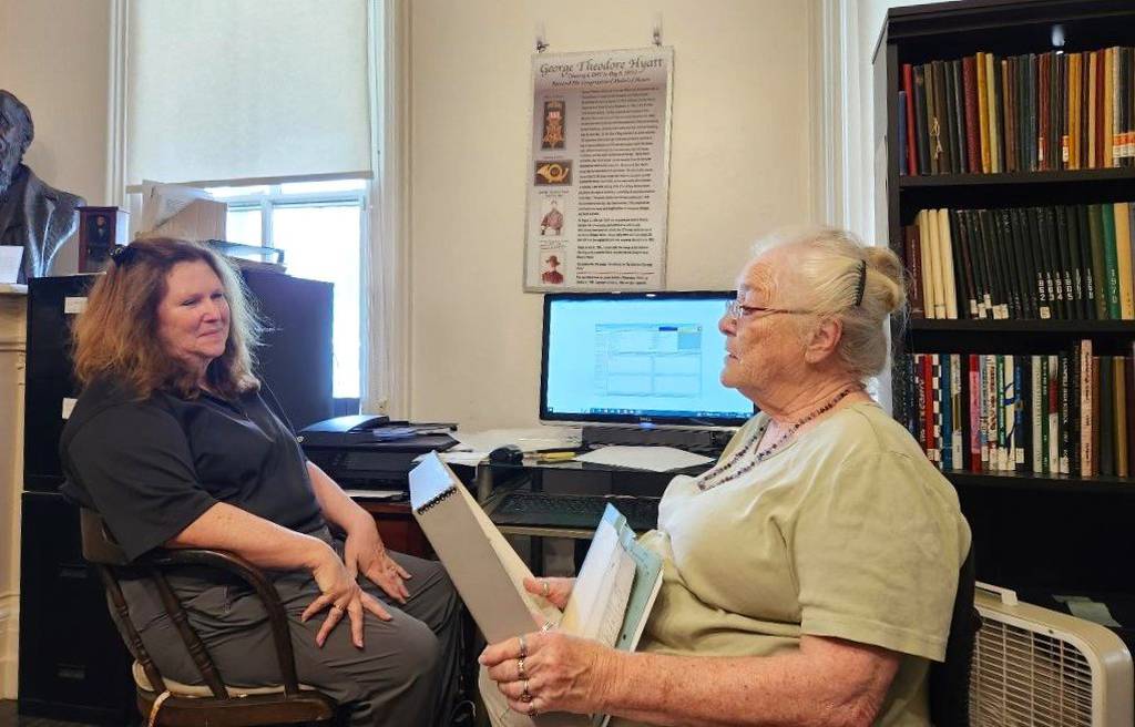Lorraine Partlow Smalley and Sandy Vasko discuss research at the Casseday home during a visit to the Will County Historical Museum and Research Center in July.