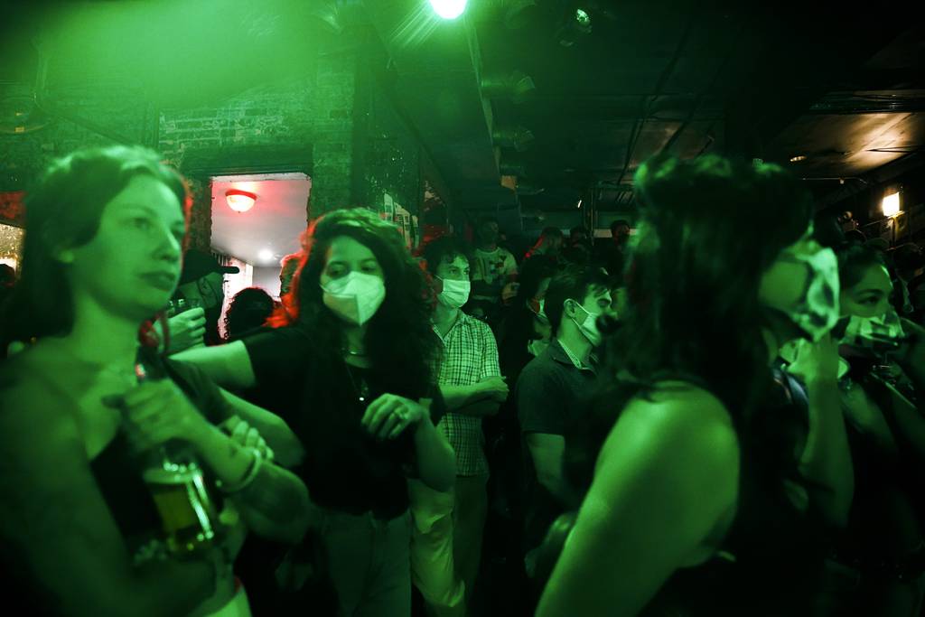People wear masks while listening to Bnny's performance at Empty Bottle in Chicago on September 2, 2021. 