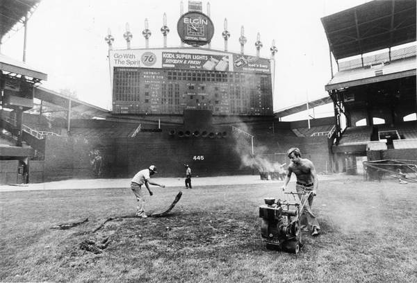 Workers replace turf damaged by several field fires at Comiskey Park on July 13, 1979.  They also had to clear the field of broken records and repair the field from the Disco Demolition Night the previous day. 