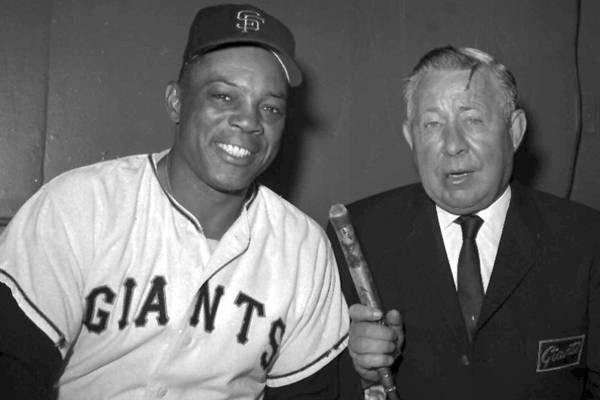 Russ Hodges, who has been broadcasting Giants games in New York and San Francisco for 18 years, interviews center fielder Willie Mays on August 30, 1966.