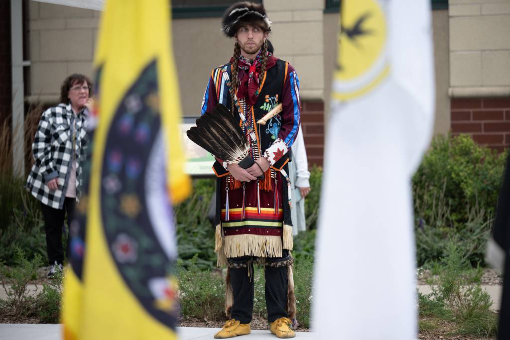 Dressed in traditional garb, Potawatomi citizen Broderick Race's Pokagon Band watches as a celebration celebrates the completion of the first segment of the Native Culture Trail at the Indiana Dunes Visitor Center on Wednesday, Sept. 27, 2023. 
