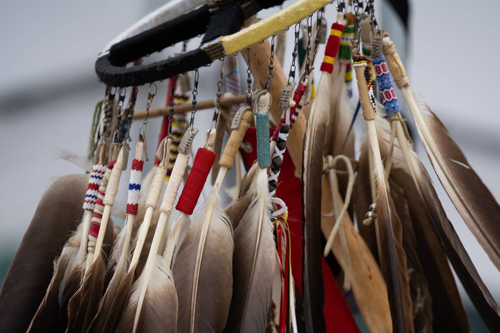 Feathers representing veterans adorn the top of the Pokagon Band of Potawotomi community Eagle Feather Staff on Wednesday, Sept. 27, 2023.