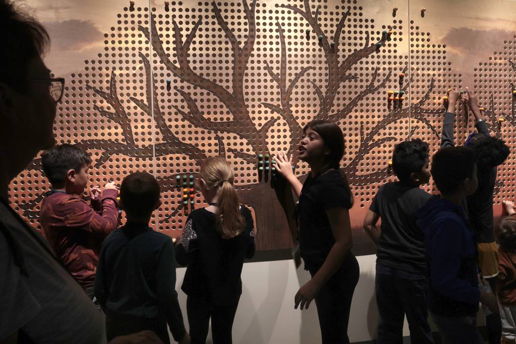 Young people interact with an exhibit at the Peggy Notebaert Nature Museum Sustainability Center, September 28, 2023. 
