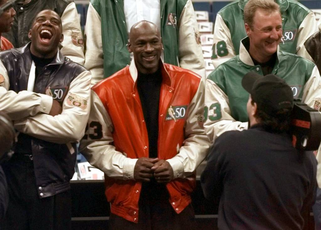 Former Los Angeles Lakers player Magic Johnson (left), Chicago Bulls' Michael Jordan, and former Boston Celtics Larry Bird take a photo during a photo shoot with the NBA Legends in Cleveland on Saturday, February 8, 1997. 