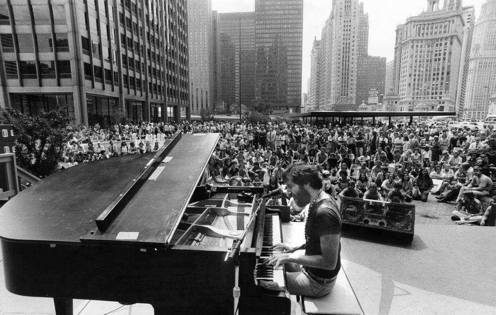 The crowd listens to the big sound of Corky Siegel at Chicago's Equitable Plaza (now called Pioneer Court) on August 10, 1977. 