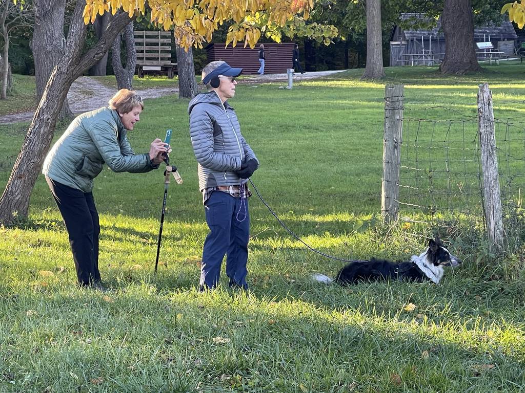 Wendy Davis of Vermont and Barb Baird of Indianapolis visited Chellberg Farm with their border collie Star on Sunday, October 22, 2023, and watched the animals being fed.