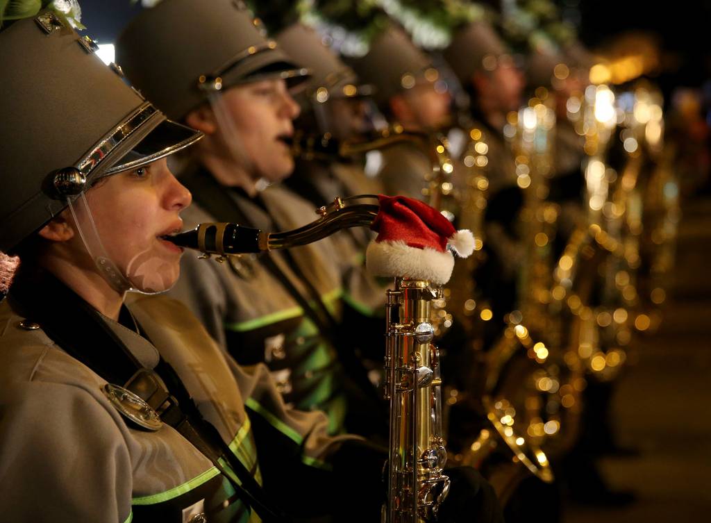 A Santa hat adorns a high school band player's saxophone at the Magnificent Mile Lights Festival on Michigan Avenue on Nov. 23, 2019.