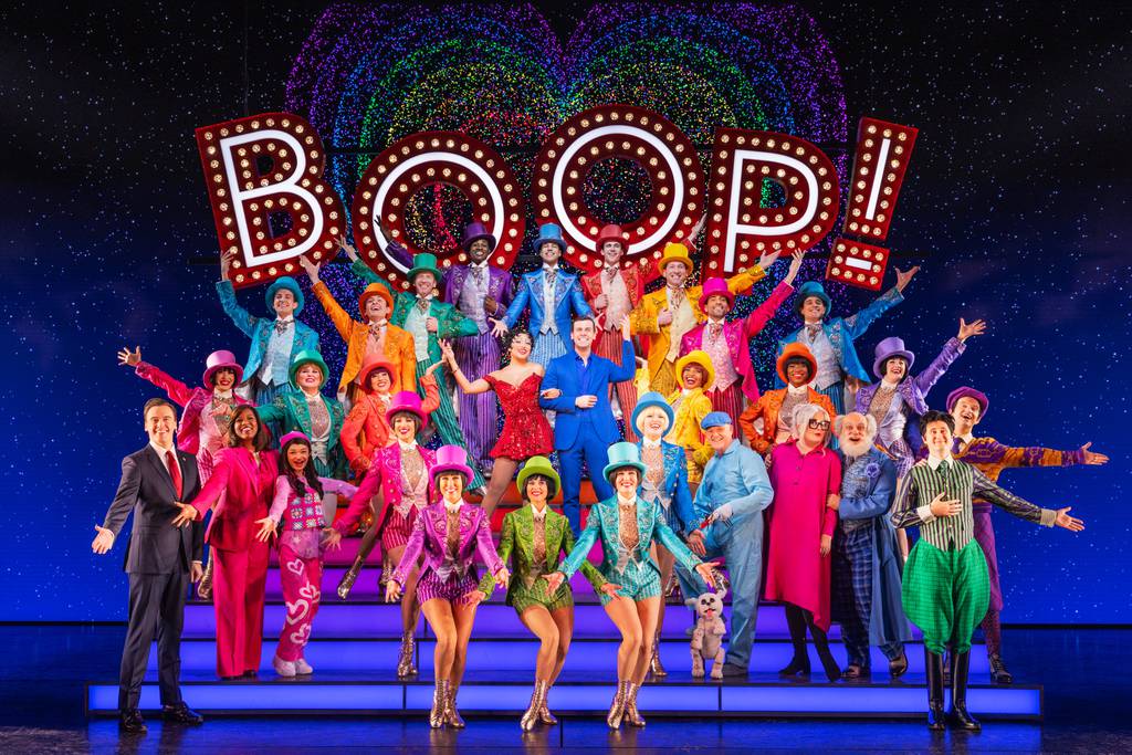 Jasmine Amy Rogers (as Betty Boop, center) with Anthony Melham (Dwayne), Erich Bergen (Raymond Demarest), Anastacia McCleskey (Carol Evans), Angelica Hale (Trisha), Phillip Huber (Pudgy), Faith Prince (Valentina), Stephen DeRosa (Grandma) and cast "Bop!  Musical" at the CIBC Theater in Chicago. 