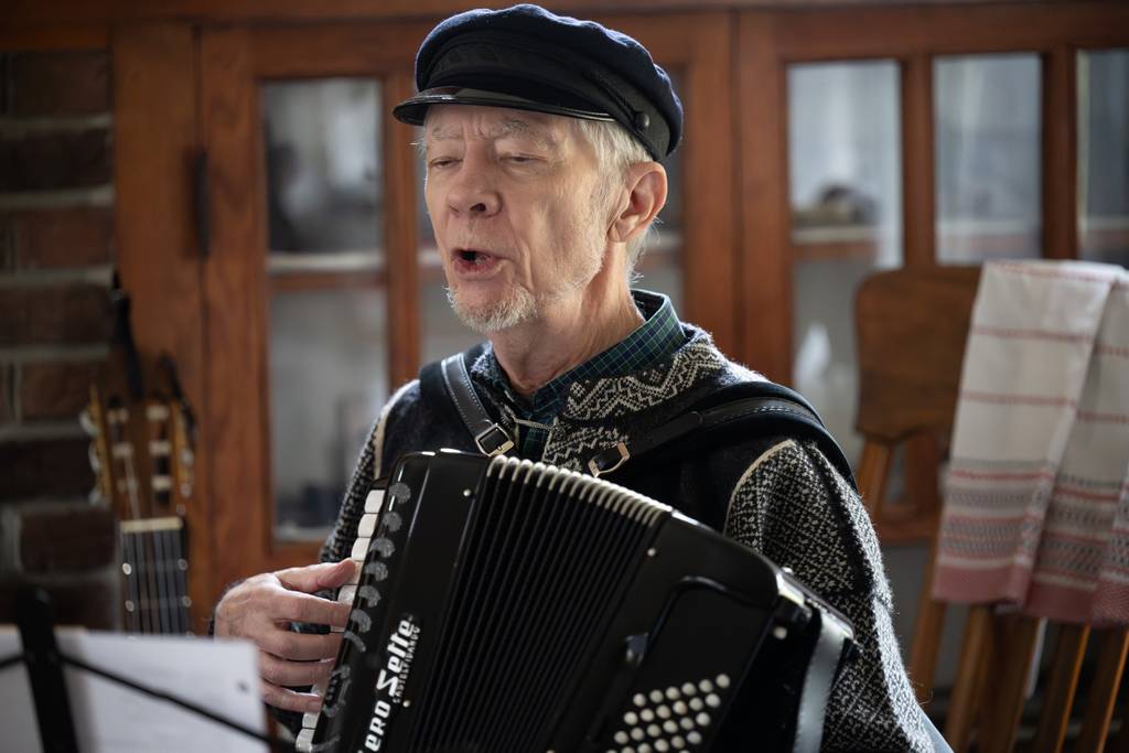 Jim Nelson, a member of the Swedish and Scandinavian country and dance music group Lingonberry Jam, sings traditional holiday music during a holiday celebration at the historic Chellberg House in Indiana Dunes National Park on Saturday, Dec. 16, 2023.  Post-Tribune)