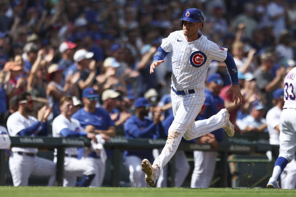 Cubs center fielder Cody Bellinger homers a double off teammate Seiya Suzuki against the Giants on September 4, 2023 at Wrigley Field. 