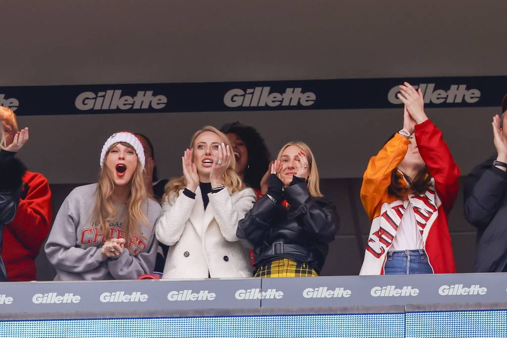Taylor Swift (left to right), Brittany Mahomes, Ashley Avignone and Alana Haim celebrate after the Chiefs scored against the Patriots on Sunday in Foxborough, Massachusetts. 