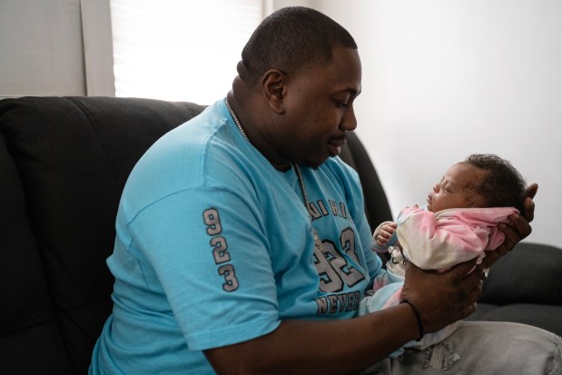 Jermaine Harris welcomed his newborn daughter, AJ, on December 26, 2023.  Harris' father, Lee Harris, died eight months after his release from prison and just before the birth of his grandchild.  Harris spent 33 years in prison and was eventually exonerated.  (E. Jason Wambsgans/Chicago Tribune)