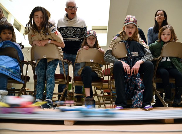 First row, second to right from left, Den 5 Scouts, 11-year-old fifth-grader Emme McDill, 10-year-old fifth-grader Tatum McCauley, and fifth-grader Clara Lang (11) in Cub, all from Winnetka Scout Pack 18 Pinewood Derby, Jan. 31 in 2024 at Winnetka Presbyterian Church (1255 Willow Road) in Winnetka.