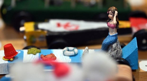 No, not Taylor Swift in the derby car parked next to the Kansas City Chiefs car.  This is a mermaid among the creative creatures decorating the cars, seen at the Cub Scout Pack 18 Pinewood Derby at the Winnetka Presbyterian Church (1255 Willow Road) in Winnetka on January 31, 2024.