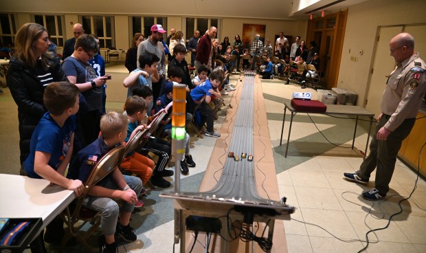 Far right, Cubmaster of Cub Scout Pack 18, Khalid Ghantous of Winnetka, is part of the action at the Cub Scout Pack 18 Pinewood Derby at Winnetka Presbyterian Church (1255 Willow Road) on Jan. 31, 2024 in Winnetka.
