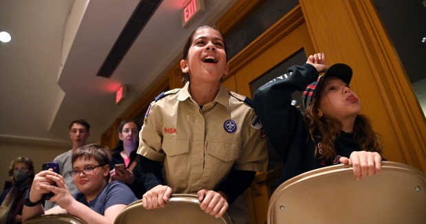 Cheering for racing action at the Cub Scout Pack 18 Pinewood Derby on Jan. 31 are, from left, Laila Dearth, 10, a fifth-grader from Winnetka, and Nora Ryadi, 11, also a fifth-grader from Winnetka.  2024 at Winnetka Presbyterian Church (1255 Willow Road) in Winnetka.