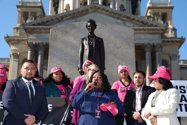 State Sen. Lakesia Collins, D-Chicago, talks about the importance of increasing the base wage for all tipped workers outside the Illinois State Capitol in Springfield on Feb. 6, 2024.  (Stacey Wescott/Chicago Tribune)