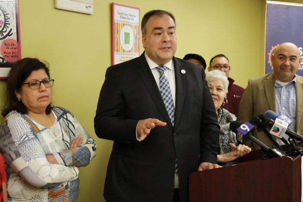 Cook County Assessor Fritz Kaegi stands with Pilsen community leaders and activists to discuss a property tax increase in Chicago's Pilsen neighborhood on Jan. 20, 2023.  (Stacey Wescott/Chicago Tribune)