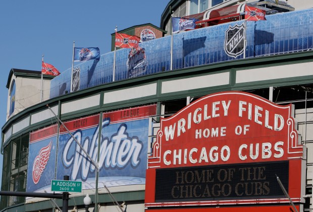 Banners and pennants from the New Year's Day NHL Winter Classic hockey game are seen on the facade of Wrigley Field in Chicago on December 29, 2008.  (M. Spencer Green/Associated Press)