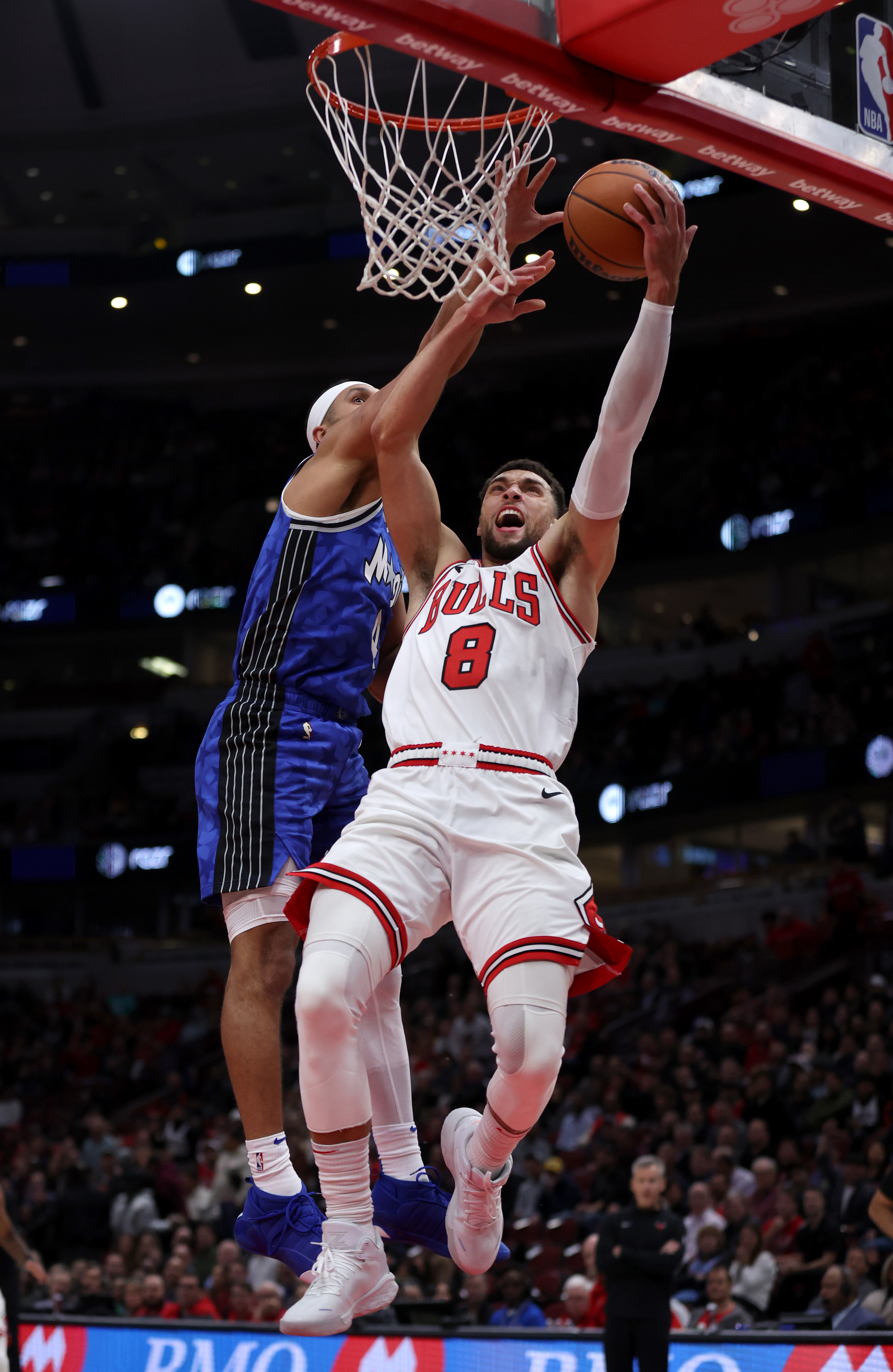 Bulls guard Zach LaVine tries to score against Magic guard Jalen Suggs during the first half at the United Center on Nov. 15, 2023.