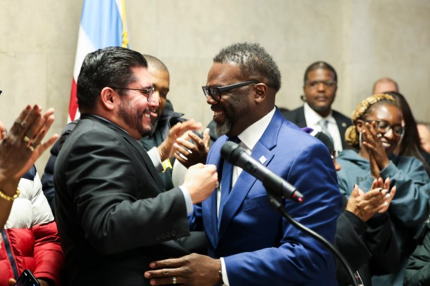 Ald.  Carlos Ramirez Rosa, 35, celebrates with Mayor Brandon Johnson and members of the Get Your House Chicago coalition at a news conference after a Chicago City Council committee passed an ordinance asking voters to increase the property transfer tax to combat homelessness, Oct. 31.  , 2023.
