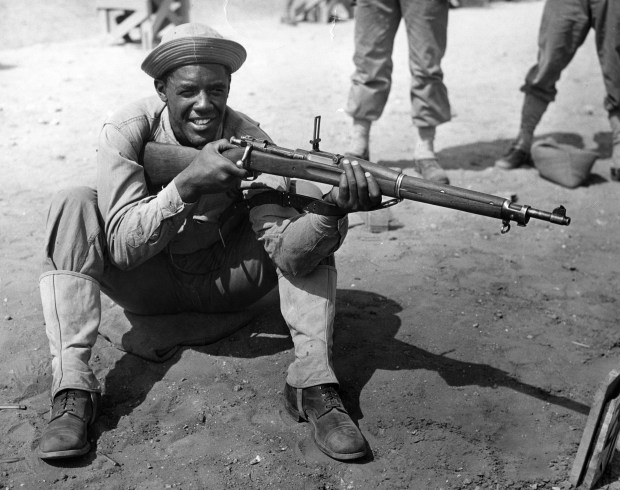 Private Fritz Pollard Jr. of Chicago.  He also served in the army like his father.  Pollard Jr. served as a rifle range instructor for other Black soldiers at the Engineer Replacement Training Center at Fort Leonard Wood, Missouri, circa 1942.  (Chicago Tribune archive)