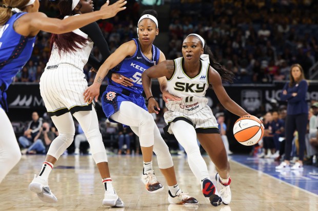 Chicago Sky guard Dana Evans (11) tries to pass Connecticut Sun guard Tyasha Harris (52) during a game at Wintrust Arena on Wednesday, July 12, 2023.  (Eileen T. Meslar/Chicago Tribune)
