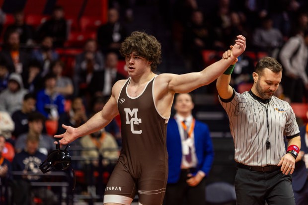 Mount Carmel's Colin Kelly after defeating Marist's Ricky Ericksen in the 175-pound match at the Class 3A state wrestling championships on Saturday, Feb. 17, 2024, at the University of Illinois State Farm Center in Champaign.  (Vincent D. Johnson / Daily Southtown) .