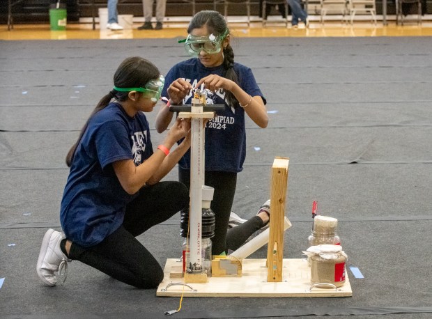 Kahler Middle School teammates Pari Patel (left) and Krupa Patel prepare to compete in the Air Orbit category competition at the Science Olympiad Regional Tournament at IU Northwest on Saturday, Feb. 17, 2024, in Gary, Indiana.  (Andy Lavalley for Post-Tribune)