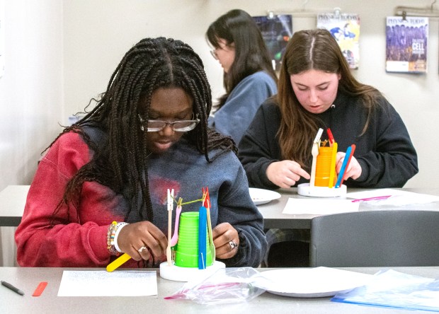Crown Point High School sophomore Akaari Koomson (15) competes in the Write, Build competition at the Science Olympiad Regional Tournament at IU Northwest on Saturday, February 17, 2024 in Gary, Indiana.  (Andy Lavalley for Post-Tribune)