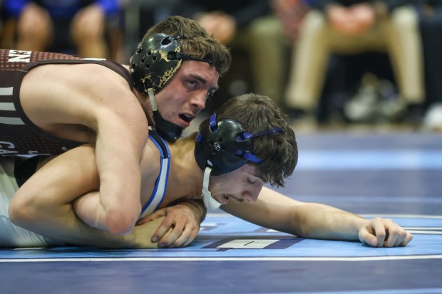 Joliet Catholic's Connor Cumbee wrestles Lincoln-Way East's Domanic Abuja in a 150-pound match in the Class 3A Downers Grove South Dual Team Regional match between Joliet Catholic and Lincoln-Way East on Tuesday, Feb. 20, 2024, in Downers Grove.  Daily Southtown)