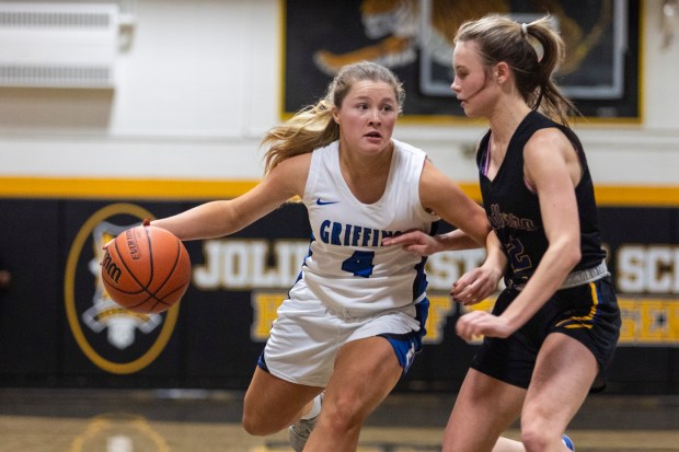 Lincoln-Way East's Alaina Vargas (4) tries to get into the lane against Sandburg's Zoe Trunk during the Class 4A Joliet West Regional semifinals on Tuesday, Feb. 20, 2024, in Joliet.  (Vincent D. Johnson / Daily Southtown).
