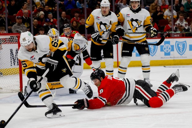 Chicago Blackhawks center Ryan Donato (8) competes for the puck during the game between the Chicago Blackhawks and the Pittsburgh Penguins at the United Center in Chicago on Thursday, February 15, 2024.  (Vincent Alban/Chicago Tribune)