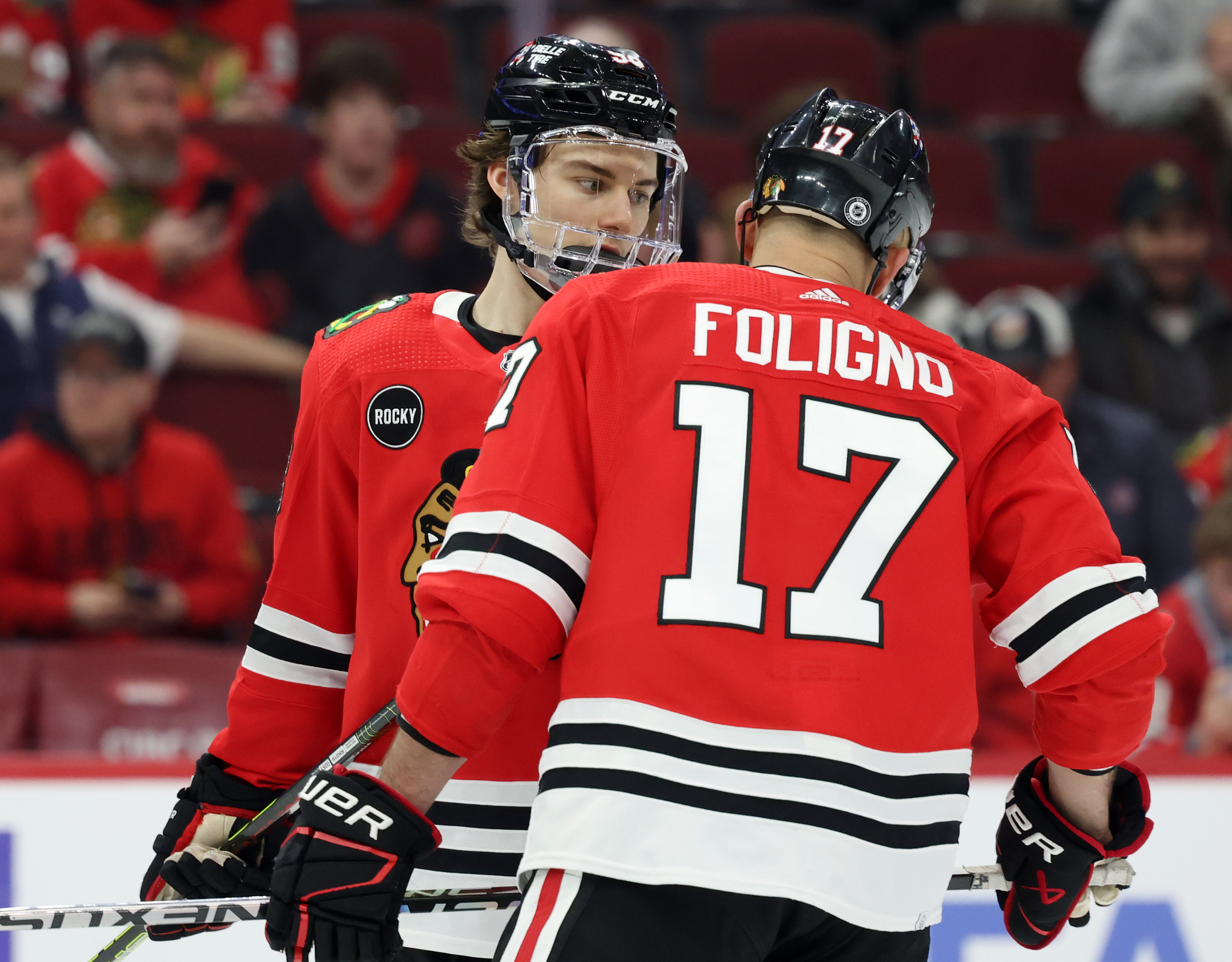 Blackhawks center Connor Bedard (98) talks to teammate left wing Nick Foligno (17) during the third period against the Flyers at the United Center on Feb. 21, 2024 in Chicago.  (John J. Kim/Chicago Tribune)