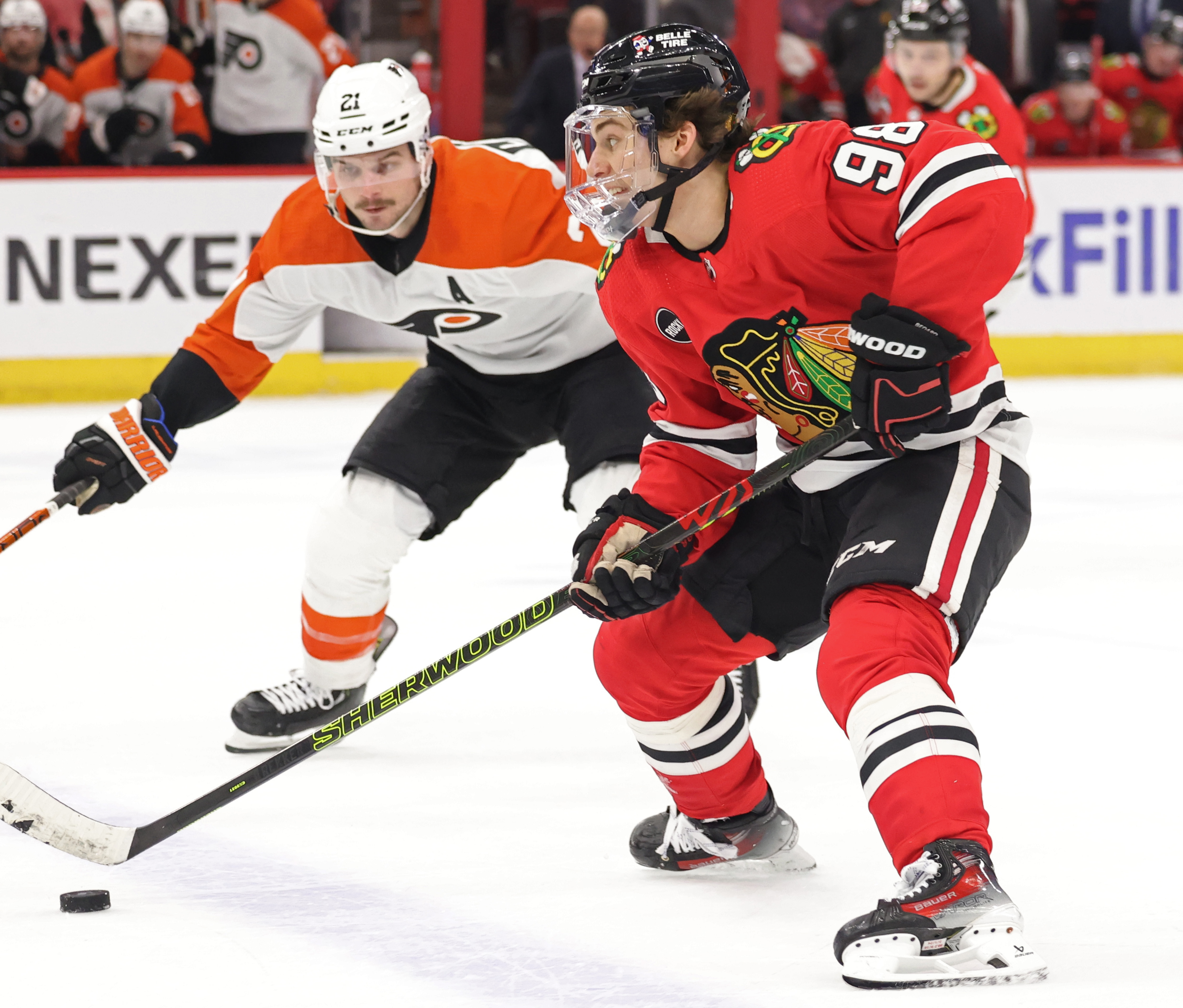 Blackhawks center Connor Bedard (98) advances the puck as Flyers center Scott Laughton (21) defends during the third period at the United Center in Chicago on February 21, 2024.  (John J. Kim/Chicago Tribune)