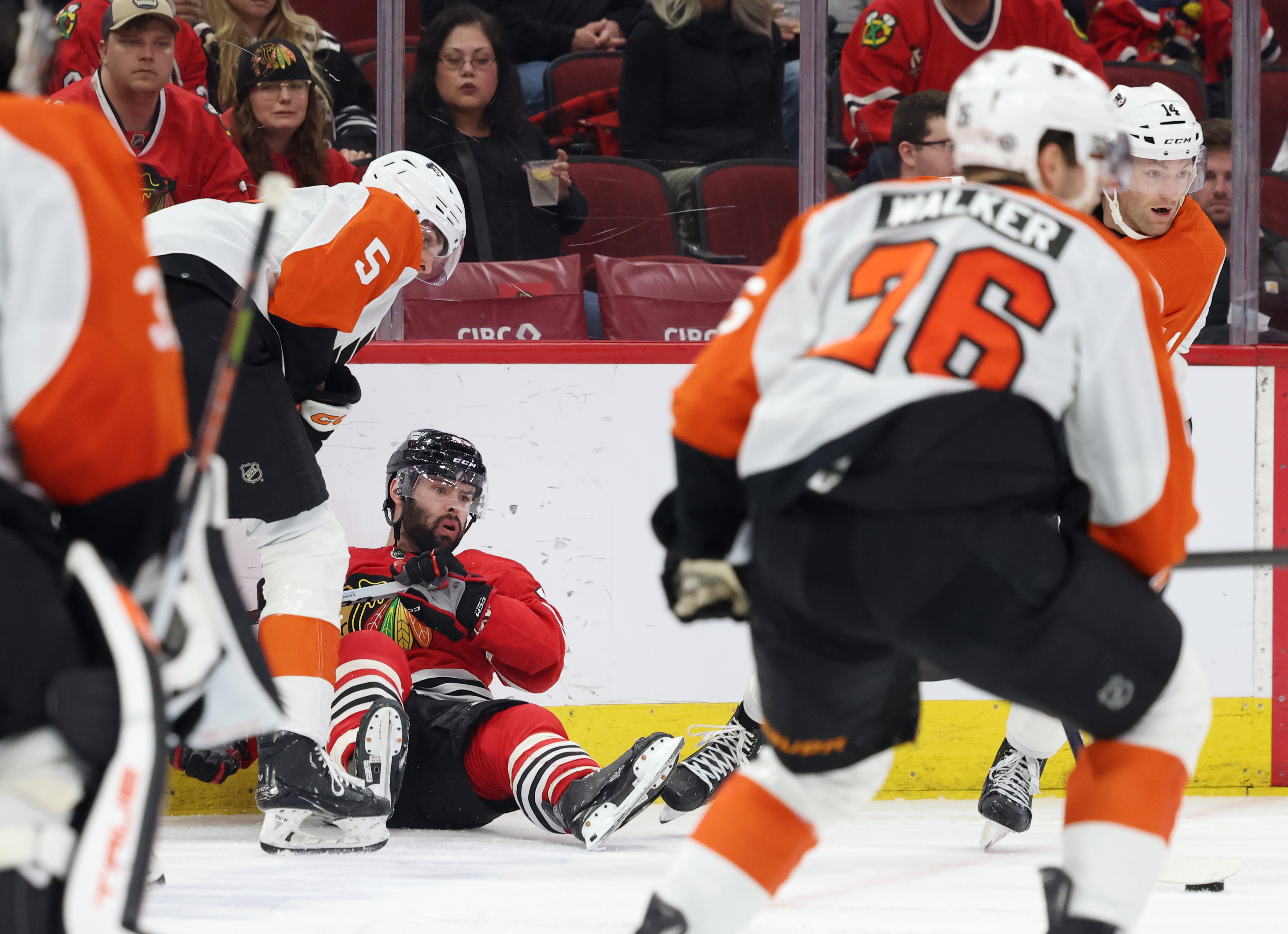 Blackhawks center Colin Blackwell (43) falls on the ice while passing the puck in the third period against the Flyers at the United Center in Chicago on February 21, 2024.  (John J. Kim/Chicago Tribune)