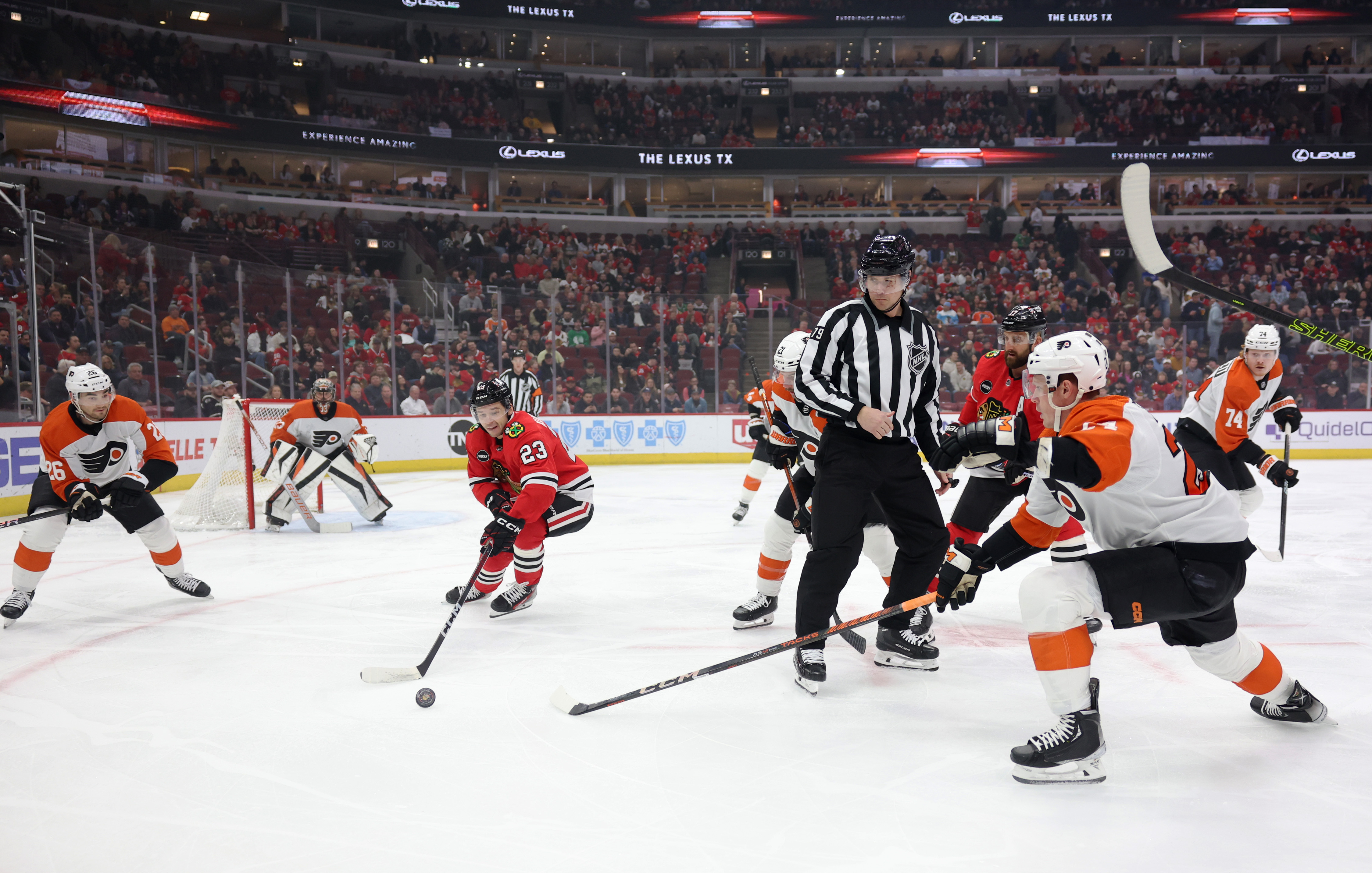 Flyers left wing Nicolas Deslauriers (44) and Blackhawks right wing MacKenzie Entwistle (58) make contact in the third period at the United Center in Chicago on February 21, 2024.  (John J. Kim/Chicago Tribune)