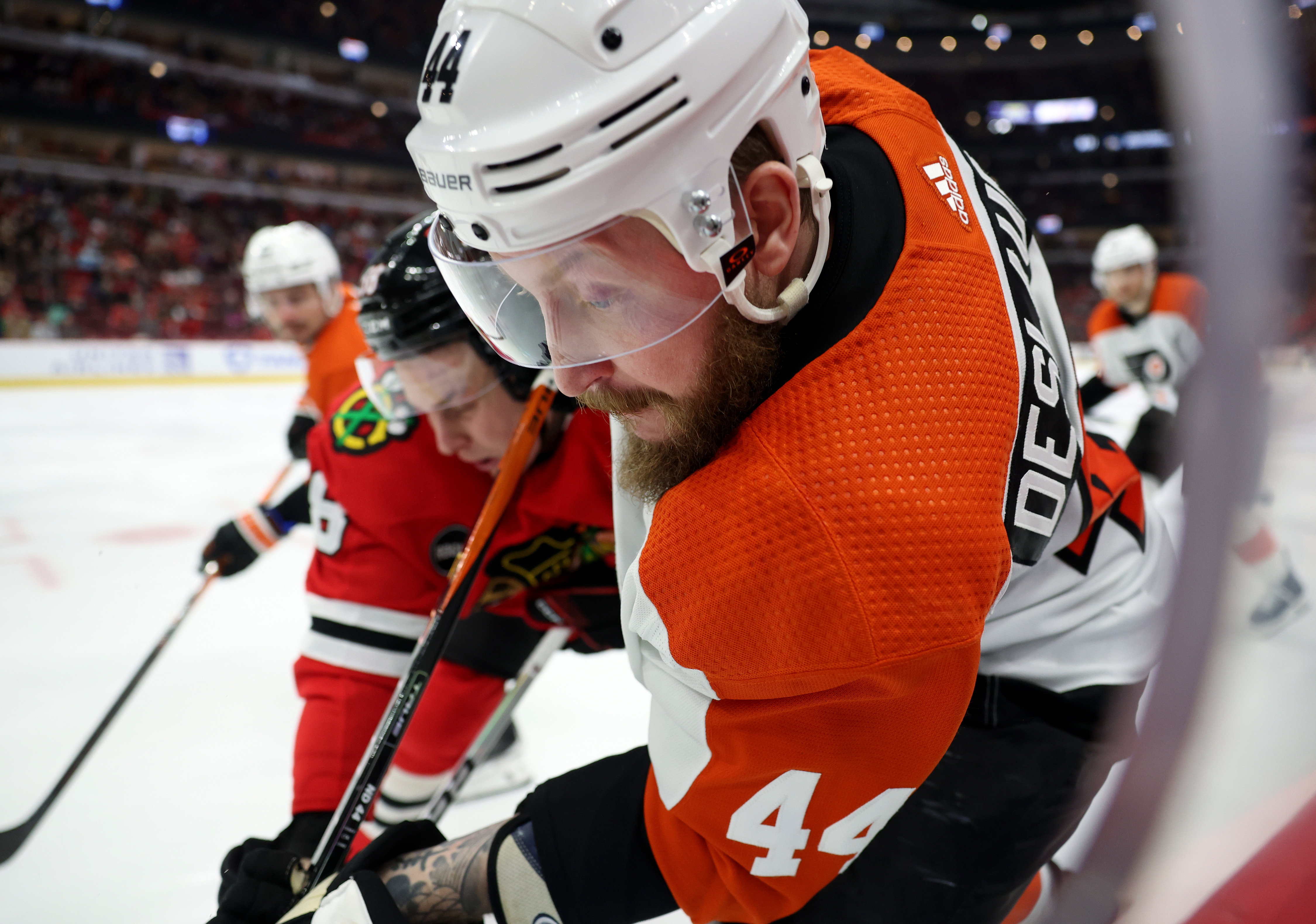 Flyers left wing Nicolas Deslauriers (44) and Blackhawks right wing MacKenzie Entwistle (58) make contact in the third period at the United Center in Chicago on February 21, 2024.  (John J. Kim/Chicago Tribune)