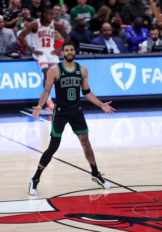 Celtics forward Jayson Tatum (0) celebrates after making a spectacular three-pointer in the second half against the Bulls at the United Center on February 22, 2024. 