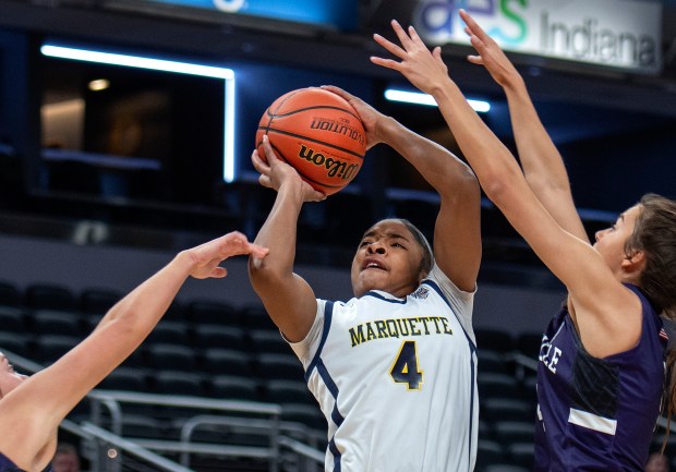 Marquette Catholic's Laniah Davis takes a shot during the Class 1A state championship game against Lanesville on Saturday, Feb. 24, 2024, at Gainbridge Fieldhouse in Indianapolis.  (For Michael Gard/Post-Tribune)