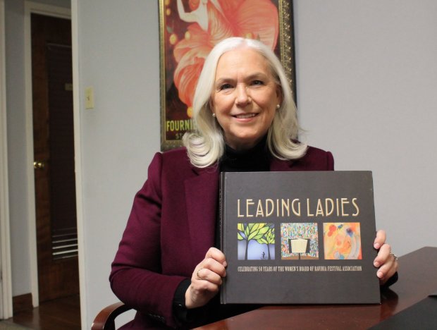 Karen Ettelson with her book about the history of the Ravinia Women's Board.  Ettelson was removed from the board for alleged conduct, but Ettelson maintains he did nothing wrong.