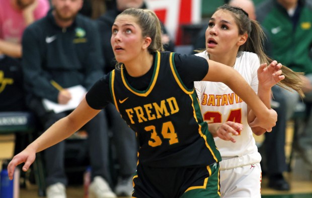 Batavia's Hallie Crane (24) and Fremd's Brynn Eshoo (34) look for a second-quarter rebound during the Class 4A Bartlett Supersectional on Monday, Feb. 26, 2024, in Bartlett.  Batavia fell to 65-46H.  Rick Bamman / For Beacon News