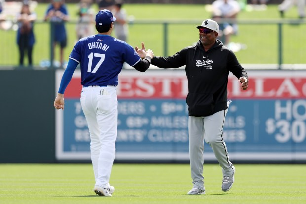 Dodgers' Shohei Ohtani greets White Sox coach Marcus Thames before the game in Glendale, Arizona, on Tuesday, February 27, 2024 (Christian Petersen/Getty Images)