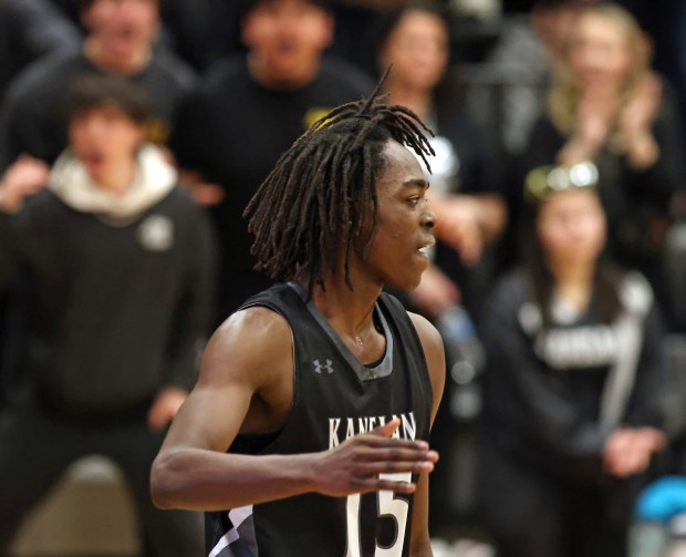 Kaneland's Freddy Hassan (15) reacts to his dunk in the fourth quarter against Belvidere North during the Class 3A Kaneland Regional semifinal game at Maple Park on Wednesday, Feb. 28, 2024.  Kaneland won 57-55.H.  Rick Bamman / For Beacon News