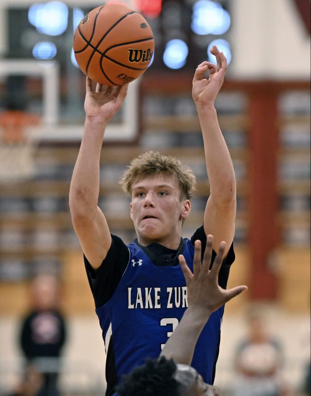 Lake Zurich's Kain Kretschmar (3) hits a field goal against Palatine in the 4th quarter of the IHSA Class 4A Elgin Regional Semifinal on Wednesday, February 28, 2024.  Palatine won the game 53-39.  (Brian O'Mahoney for News-Sun)